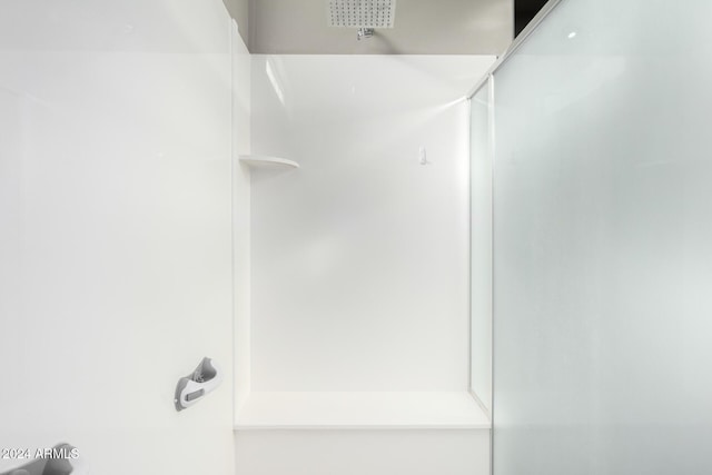 bathroom featuring walk in shower