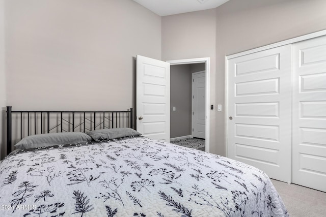 carpeted bedroom with a closet