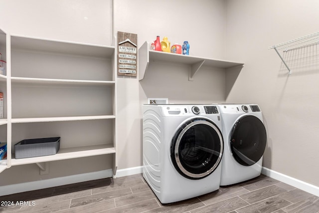 laundry area featuring independent washer and dryer and wood-type flooring