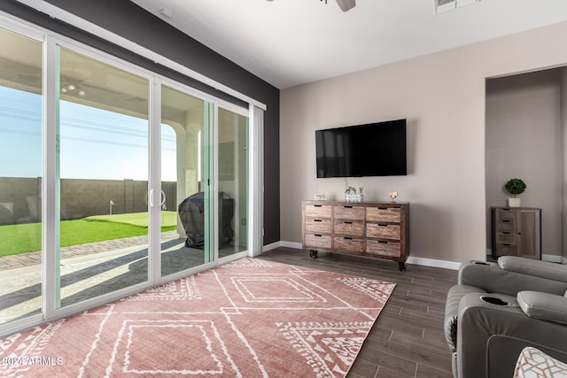 living room with hardwood / wood-style flooring and ceiling fan