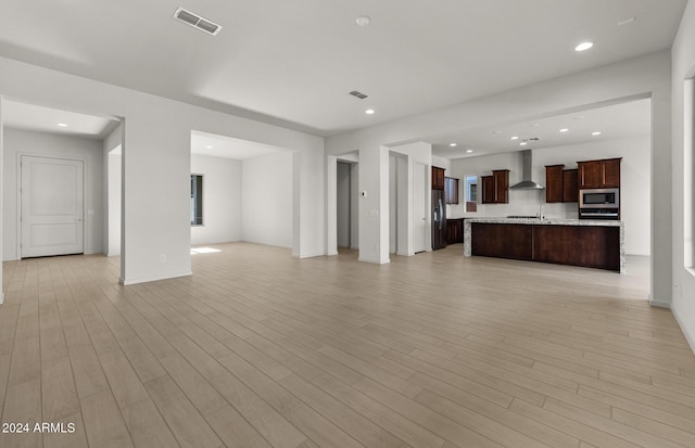 unfurnished living room featuring light wood-type flooring