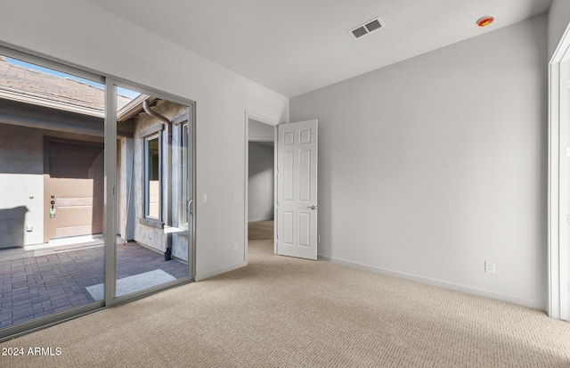 unfurnished bedroom with multiple windows and carpet