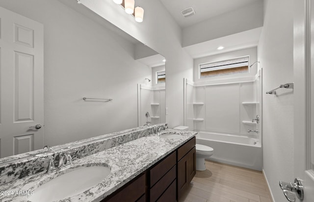 full bathroom featuring shower / bathing tub combination, vanity, toilet, and wood-type flooring