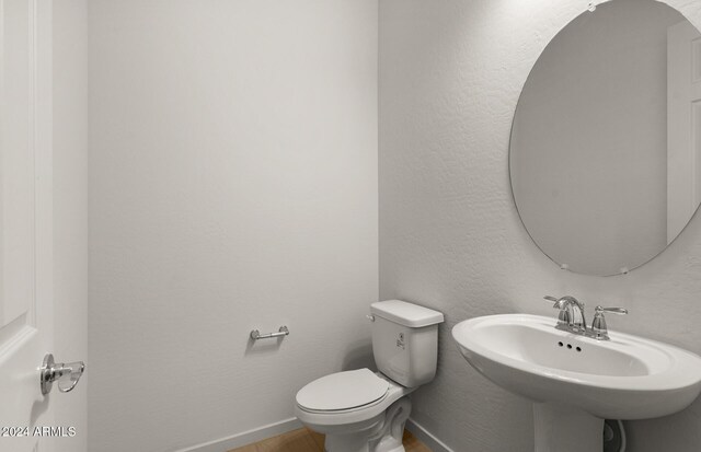 bathroom with toilet and sink