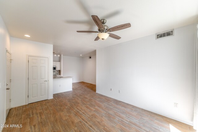 empty room with light hardwood / wood-style flooring