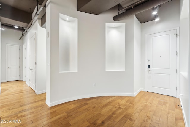 corridor featuring light wood-type flooring