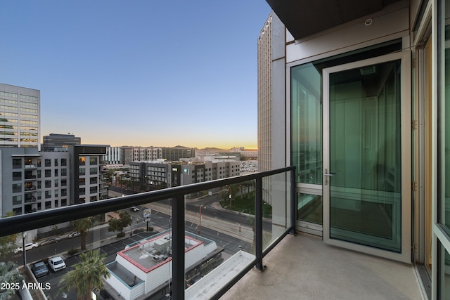 view of balcony at dusk