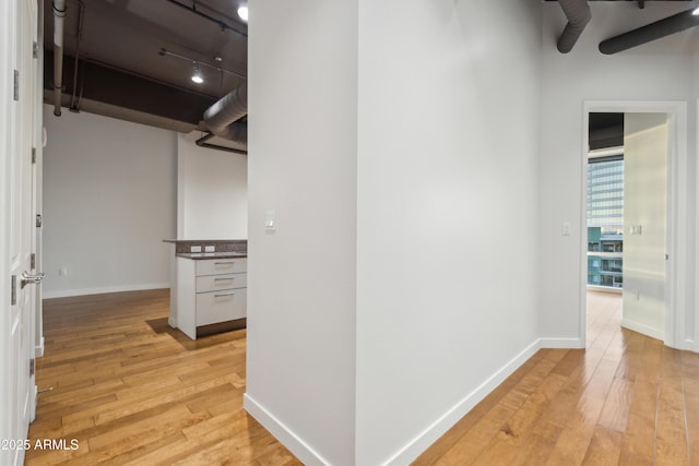 hall with light hardwood / wood-style flooring