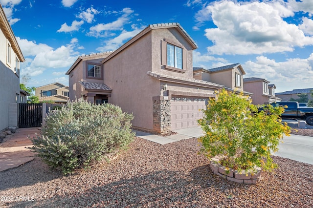 11383 W Pima St, Avondale, AZ 85323 - view of side of property with stucco siding, a garage, a tiled roof, and stone siding