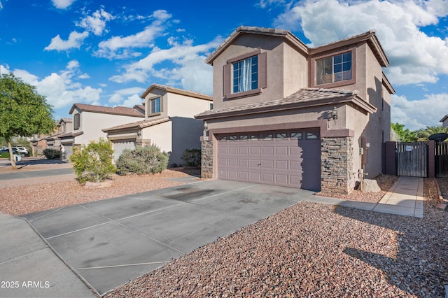 11383 W Pima St, Avondale, AZ 85323 - traditional-style house with stucco siding, a garage, driveway, a gate, and stone siding