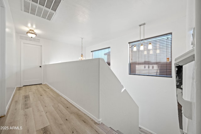11383 W Pima St, Avondale, AZ 85323 - hallway featuring light wood-style flooring and baseboards