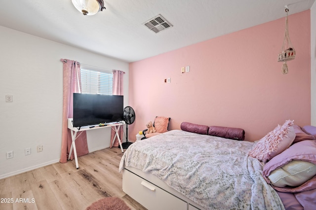 11383 W Pima St, Avondale, AZ 85323 - bedroom featuring light wood-style flooring and baseboards