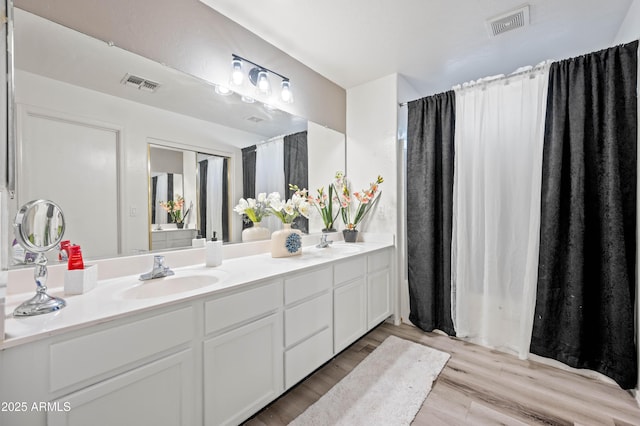 11383 W Pima St, Avondale, AZ 85323 - full bath featuring double vanity and wood finished floors