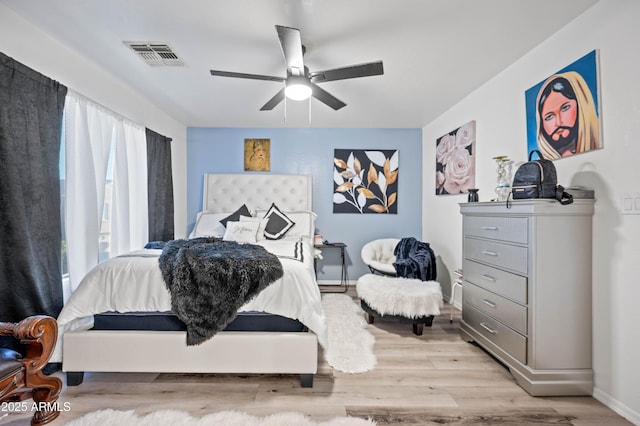 11383 W Pima St, Avondale, AZ 85323 - bedroom with light wood-style flooring and a ceiling fan