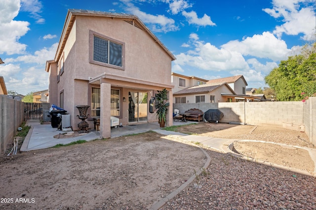 11383 W Pima St, Avondale, AZ 85323 - back of house with a patio area, stucco siding, and a fenced backyard