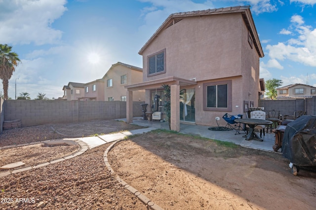 11383 W Pima St, Avondale, AZ 85323 - back of property with stucco siding, a patio area, and a fenced backyard