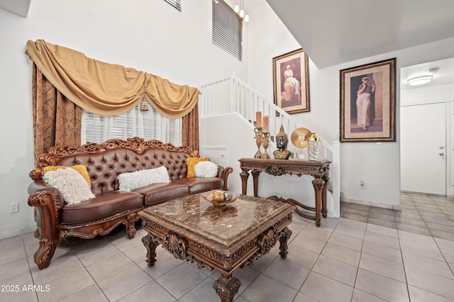 11383 W Pima St, Avondale, AZ 85323 - living area with light tile patterned floors, stairway, and a towering ceiling