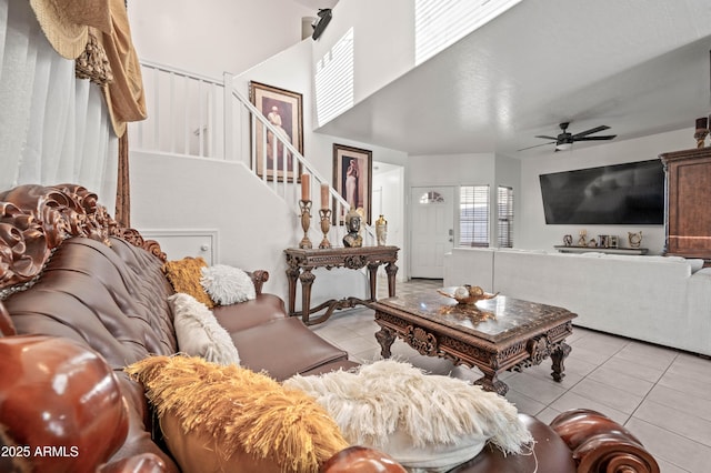 11383 W Pima St, Avondale, AZ 85323 - living room with light tile patterned floors, stairs, and a ceiling fan