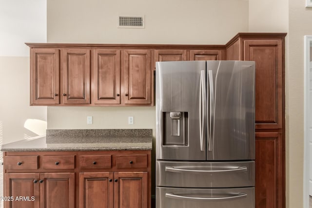 kitchen with stainless steel refrigerator with ice dispenser