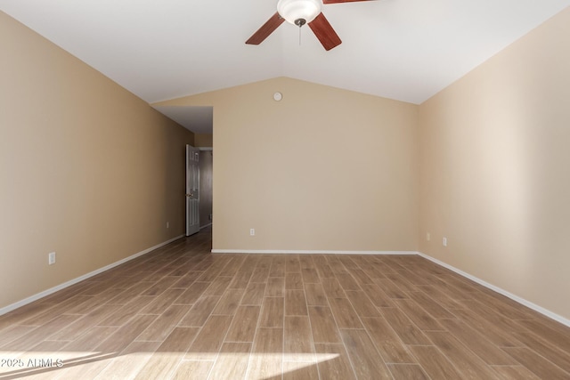 unfurnished room featuring ceiling fan, vaulted ceiling, and light hardwood / wood-style floors