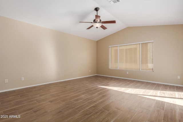 spare room with lofted ceiling, hardwood / wood-style floors, and ceiling fan