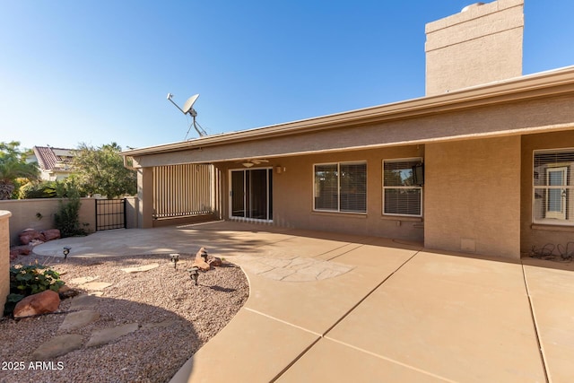 back of house featuring a patio and ceiling fan