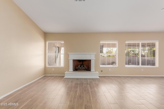 unfurnished living room featuring light hardwood / wood-style floors