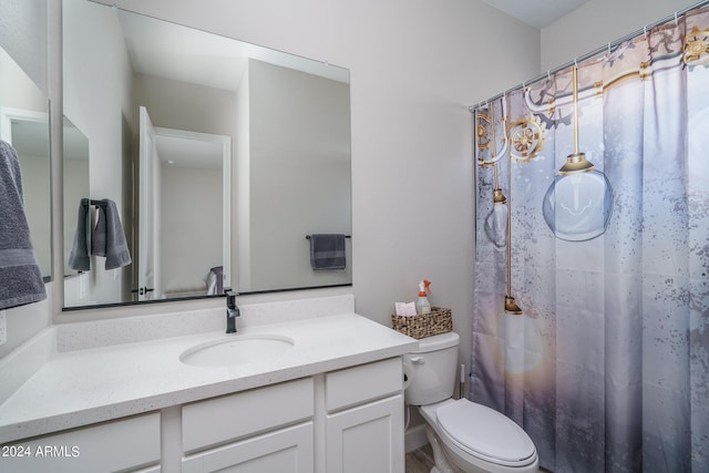 bathroom with vanity, toilet, and a shower with shower curtain