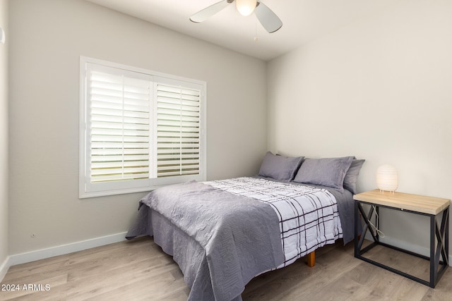 bedroom featuring light hardwood / wood-style floors and ceiling fan