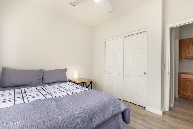 bedroom featuring a closet, ceiling fan, and light hardwood / wood-style flooring