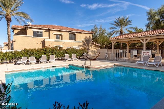 view of swimming pool featuring a patio