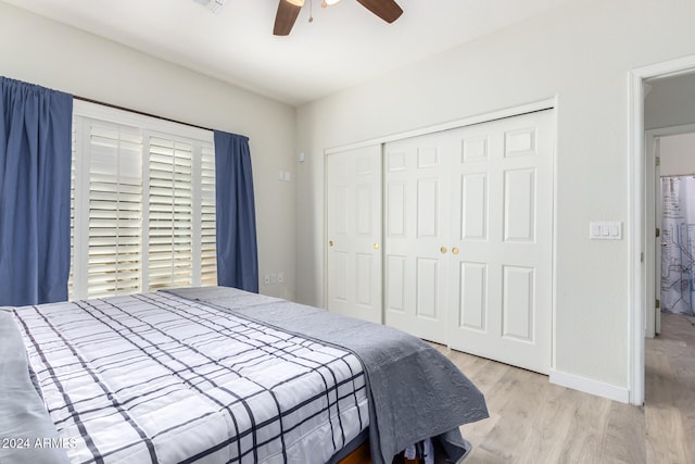 bedroom featuring a closet, ceiling fan, and light hardwood / wood-style floors