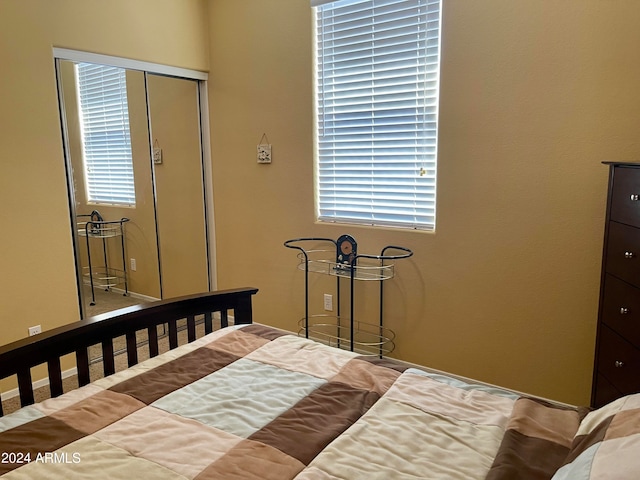 bedroom featuring a closet and multiple windows