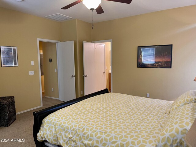 bedroom featuring light colored carpet