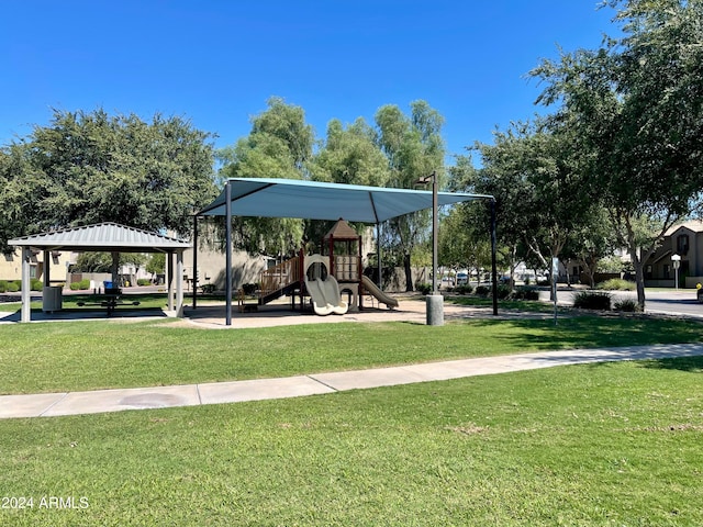 view of property's community with a yard, a gazebo, and a playground