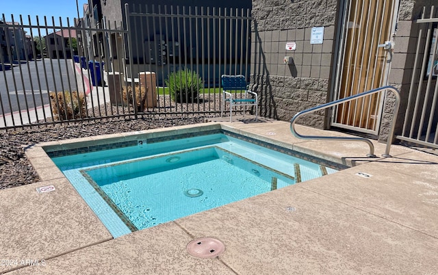 view of pool featuring a community hot tub