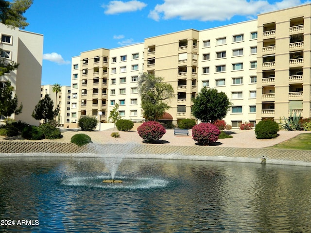 view of building exterior featuring a water view