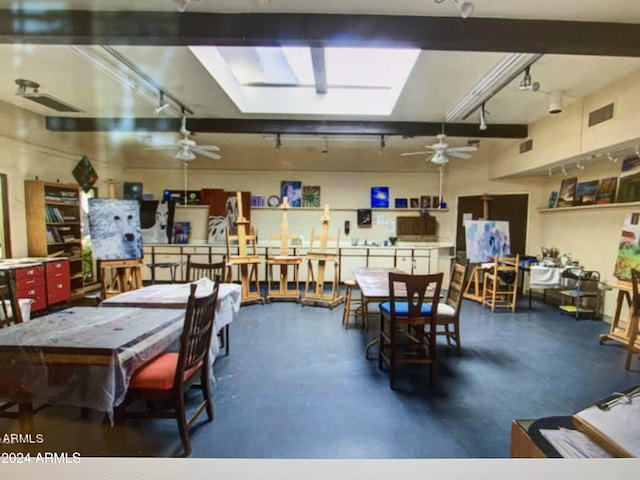 dining area with ceiling fan and concrete floors