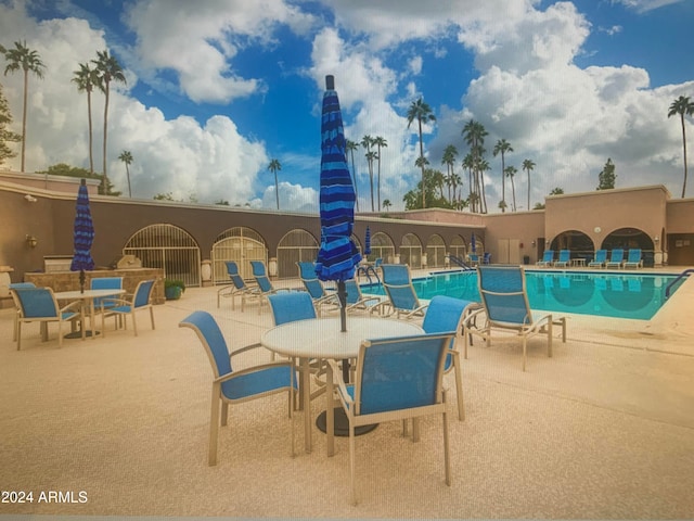 view of pool featuring a patio area