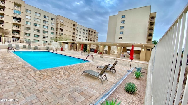 view of swimming pool with a patio area