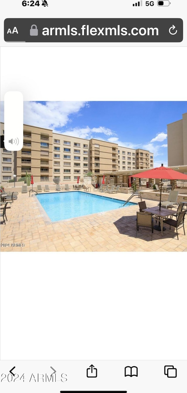 view of pool featuring a patio area