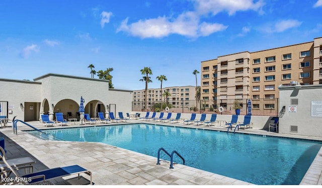 view of swimming pool with a patio