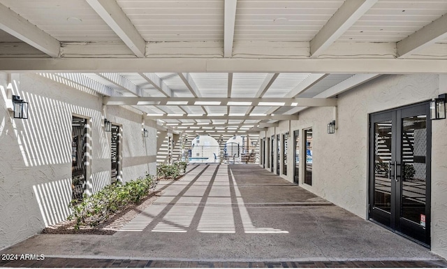 corridor featuring french doors