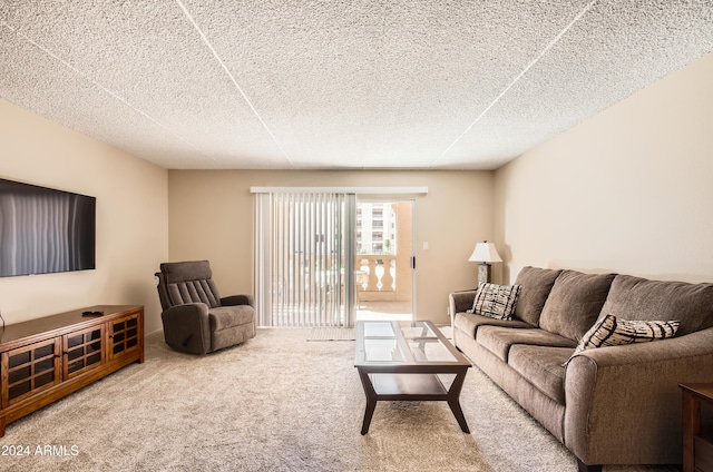 carpeted living room with a textured ceiling