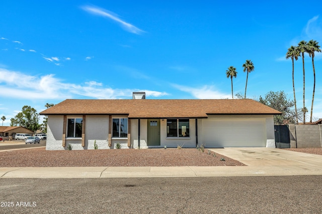 3614 W Danbury Dr, Glendale, AZ 85308 - single story home featuring a garage, concrete driveway, stucco siding, and a chimney