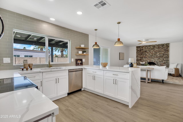 3614 W Danbury Dr, Glendale, AZ 85308 - kitchen with stainless steel dishwasher, a peninsula, open floor plan, light wood finished floors, and a ceiling fan