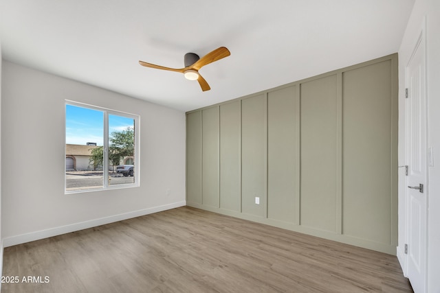 3614 W Danbury Dr, Glendale, AZ 85308 - unfurnished bedroom featuring a decorative wall, light wood-style floors, and ceiling fan