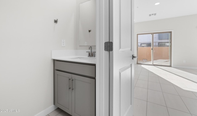 bathroom with vanity and tile patterned flooring