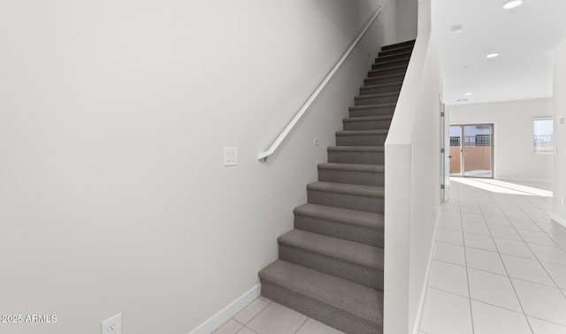 stairs with tile patterned flooring