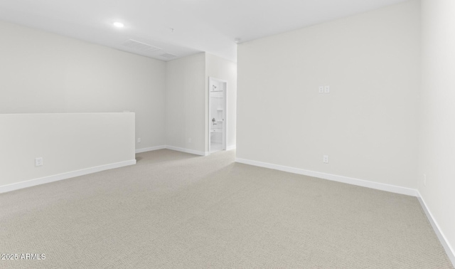 empty room with light colored carpet